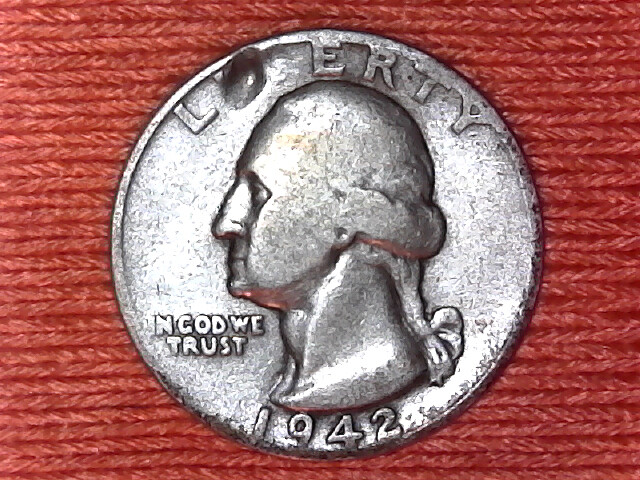 1942 quarter lamination error showing peeling metal flap and void on coin surface